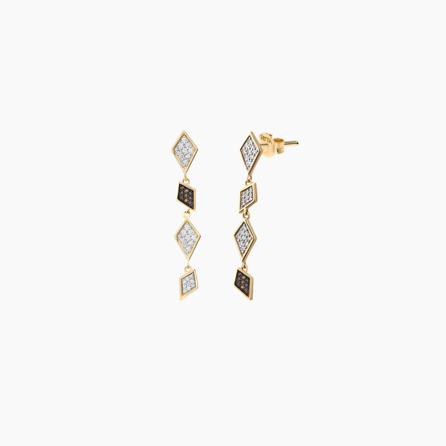 A pair of gold-colored diamond earrings with a geometric pattern, featuring pave diamonds.