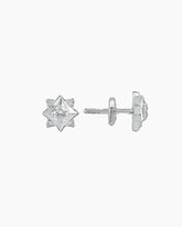 A pair of white gold stud earrings with a star-shaped design, featuring multiple smaller studs arranged in a pattern.