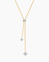 Gold necklace with star-shaped pendants on a white background