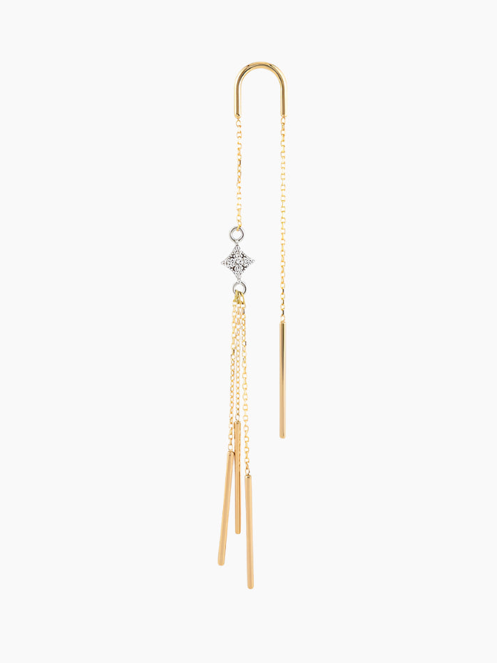 Gold threader earring with star and tassel design on a white background