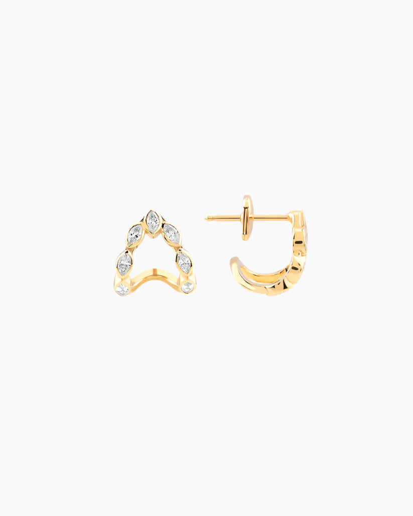 Gold heart-shaped earrings on a white background