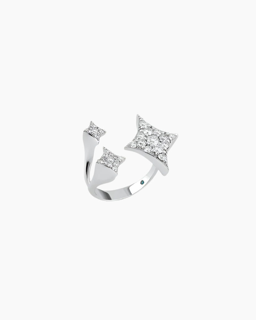 Silver ring with star-shaped diamond designs on a white background