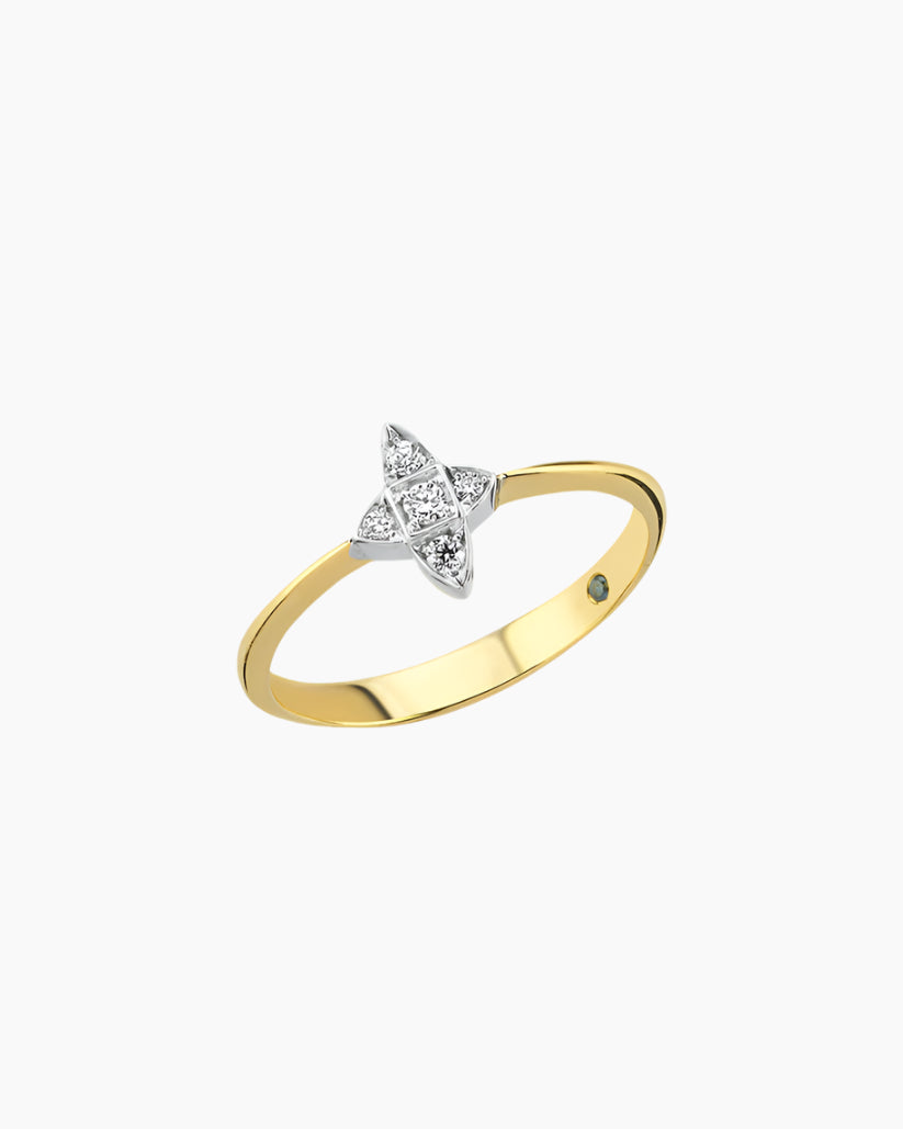 Gold ring with a diamond bow-shaped design on a white background